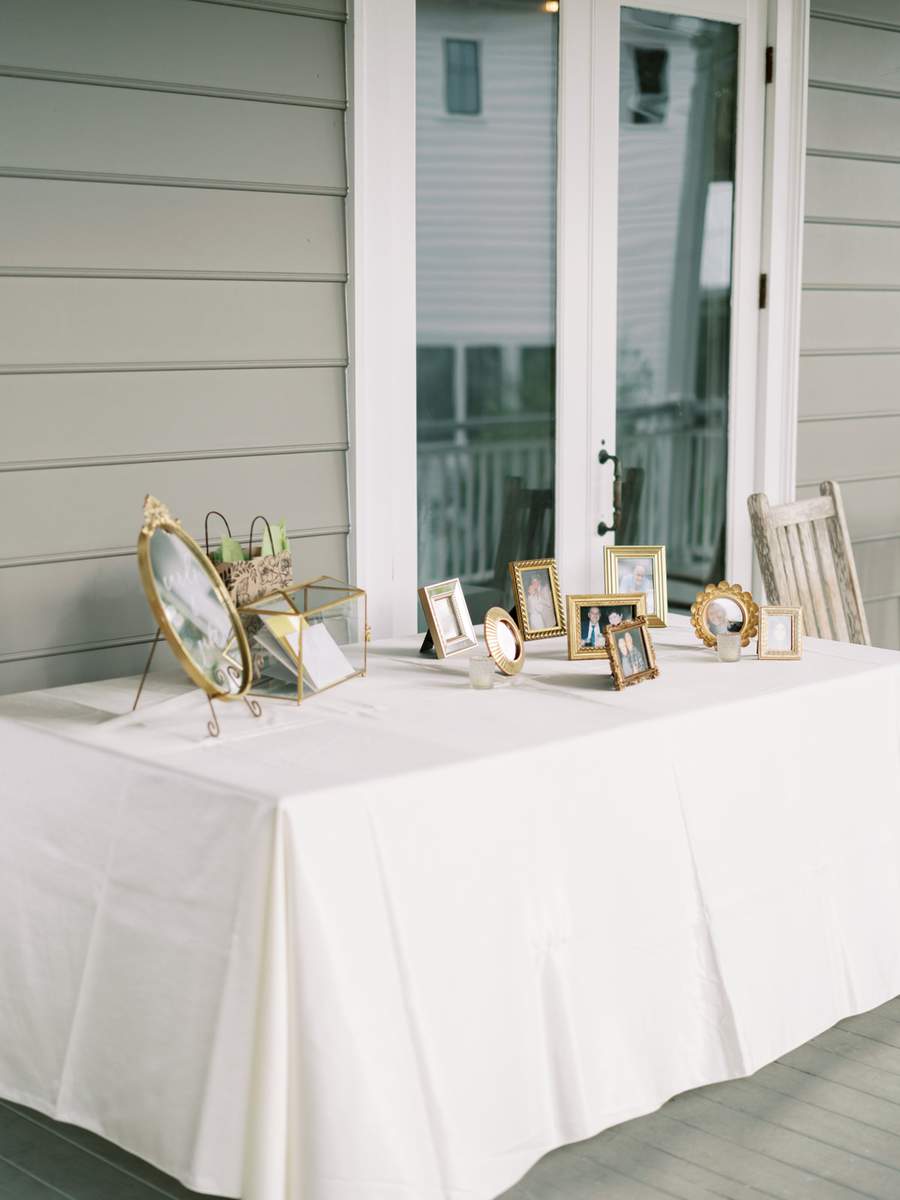 Gold frames small ornate mirrors and card box on gift table